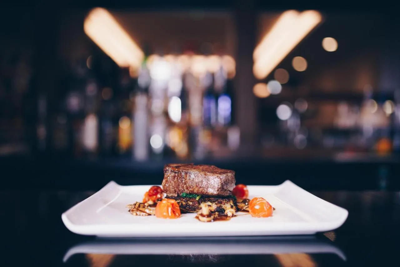 a piece of food on a plate on a table at The County Aparthotel in Newcastle upon Tyne